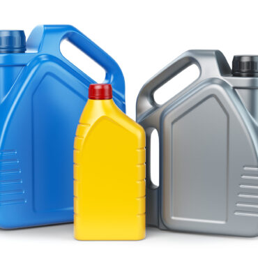 Different types of plastic canisters of motor oil on white isolated background. 3d illustration